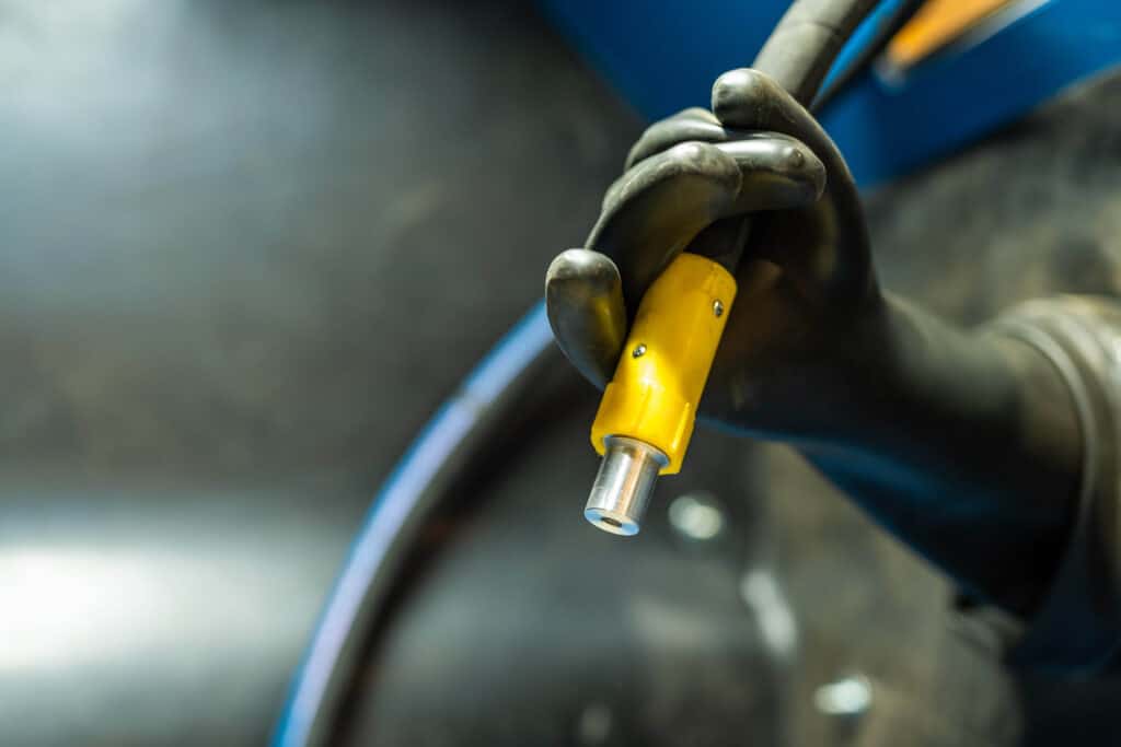 Close-up of the blast hose and blast nozzle of the Airblast blast cabinet.