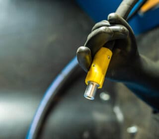 Close-up of the blast hose and blast nozzle of the Airblast blast cabinet.