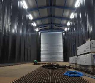 he enclosure of a surface treatment facility where blasting takes place.