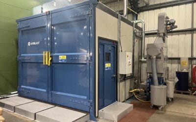 Sound attenuated blast room with rail loading system.