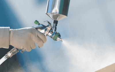 Upclose shot of someone using a spray gun.